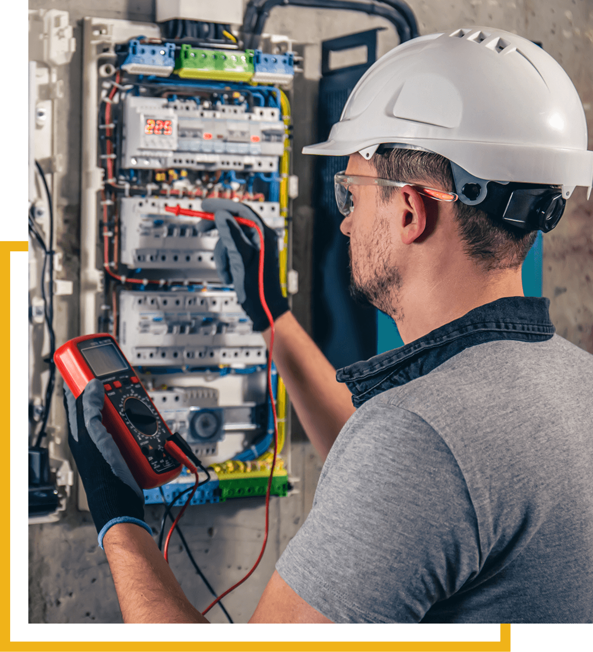 Electrician testing circuit with multimeter tool.